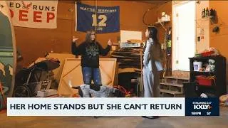 Thumbnail: Her home stands but she can't return