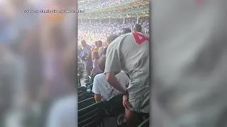 Thumbnail: Cubs fan caught on video smacking younger fan in head for not standing for anthem speaks out