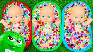 Thumbnail: Three Baby Dolls Sorting Beads into Three Bowls