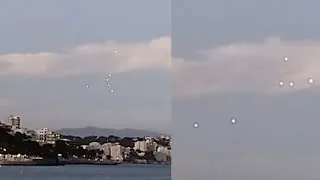 Thumbnail: Unexplained Glowing Orbs in Strange Formation Captured Fading In and Out Over Mallorca, Spain