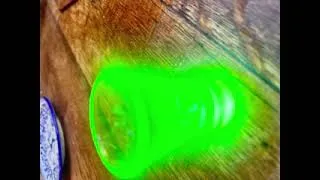Thumbnail: A vintage uranium glass shot glass with a distinctive green glow