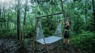 Thumbnail: setting up camp with placstic wrap in the rain-living off the power grid
