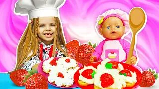 Thumbnail: Maya and her doll have a waffle-making competition, and her mom helps them.