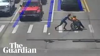 Thumbnail: Driver dressed as Spider-Man helps man in wheelchair cross road
