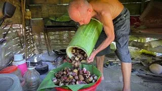 Thumbnail: An 80-year-old man living off the grid and his unique cooking method using giant bamboo tubes.