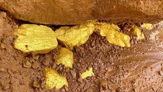 Thumbnail: Digging treasure gold under stone of mountain