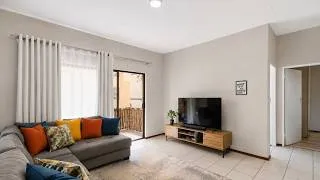 Thumbnail: Modern Open-Plan Apartment with Covered Balcony and Built-in Braai