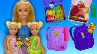 Thumbnail: Barbie & Ken Doll Family Packing Backpacks and Lunchboxes