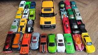 Thumbnail: Big Number of Toy Cars for Kids and a Large Yellow SUV in the Middle