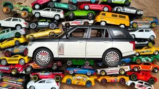 Thumbnail: Big SUV and Lots of Tiny Toy Cars Around