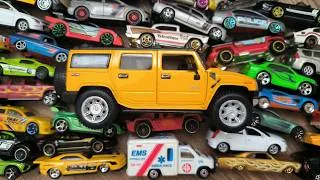 Thumbnail: Yellow SUV (Hummer) Surrounded by Tiny Toy Cars