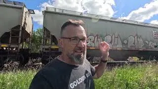 Thumbnail: Grain unit train rolling along the Bow River