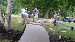 Thumbnail: Curved Concrete Sidewalk Pour with 27 cu ft Power Buggy | Smooth Finish Technique