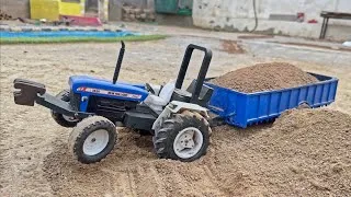 Thumbnail: Remote control homemade tractor New Holland with Loded trolley working in new project @MrPendujatt22
