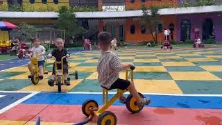 Thumbnail: The children are riding their bicycles in the schoolyard