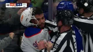 Thumbnail: Evander Kane comes after Jake McCabe during a scrum between the Oilers and Maple Leafs