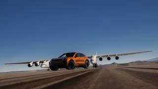 Thumbnail: Can the Porsche Cayenne Turbo Electric keep pace with the world's largest aircraft?