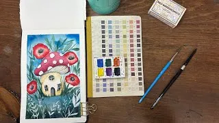 Thumbnail: Watercolor Journal Day 236 (Cozy Forest Mushroom House and Poppies)