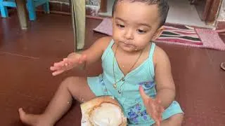 Thumbnail: Baby enjoying coconut 