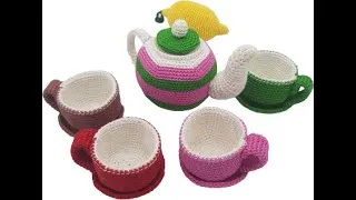 Thumbnail: This is a little knitted tea set. There is 4 cups and saucers ,1 teapot the lid of the teapot does.