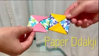 Thumbnail: Paper Ddakji || Squid Game Paper FlipGame || 딱지치기 韓國🇰🇷傳統遊戲 - 打畫片