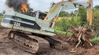 Thumbnail: Excavator is trying to dig up a big tree stump
