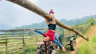 Thumbnail: Agricultural vehicle transporting wood in the countryside; girl logging alone.