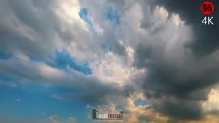 Thumbnail: Timelapse of dramatic blue sky with fast-moving clouds and sunbeams