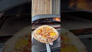 Thumbnail: Cheddar-stuffed pizza cornicione, slow-baked in the Ooni Koda 2 Pro. 👌🏻 #shorts #pizza
