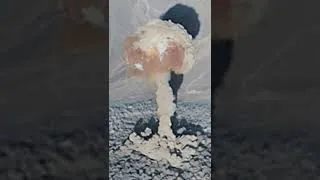 Thumbnail: Aerial view of atom bomb blast fireball and cloud