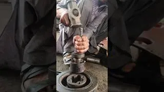 Thumbnail: mechanic repairing a heavy vehicle component bearing