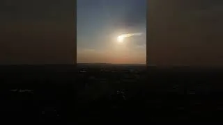Thumbnail: Shooting star (meteorite) captured during the eclipse of the sun