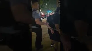 Thumbnail: Woman and man escorted in handcuffs near Soldier Field