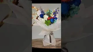 Thumbnail: Blue with white flowers wrapping  #flowers #diybouquet #flowertech9