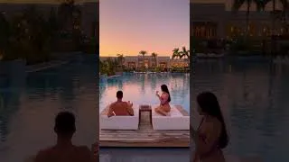 Thumbnail: A front row seat to sunset, framed by palms & echoed in the stillness of the pool | JAZ Hotel Group