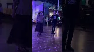 Thumbnail: Snake & Jake’s owner Dave Clements & cowgirl dance to the live music of Mike Buck & Eve Monsees