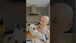 Thumbnail: Cuddling a boxer puppy