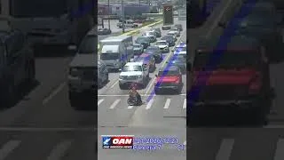 Thumbnail: Driver dressed as Spider-Man jumped out of his car to help a man in a wheelchair cross intersection