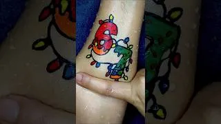 Thumbnail: 67 Christmas Lights🧑🏻‍🎄🎄 Temporary Tattoo on hand by floating pen | omggshorts #shorts #tattoo #art