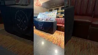 Thumbnail: Settin’ up shop at the Causeway Card Show inside Big Night Live — right under the Garden lights. 💯