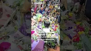 Thumbnail: Flowers at the Black Sabbath bench on Broat St Birmingham  for Ozzy Osbourne