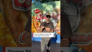 Thumbnail: Thomas Sticha reviews the giant egg roll on-a-stick #ThomasSticha