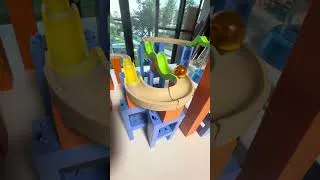 Thumbnail: A winding green marble run.#marblerun