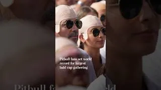 Thumbnail: Pitbull fans set world record for largest bald cap gathering